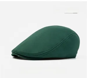Close-up of army green cotton newsboy cap showing premium stitching and fabric texture