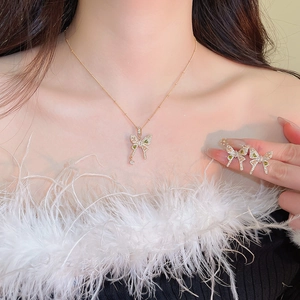 Elegant gold butterfly necklace and earring set with green and clear zircon stones