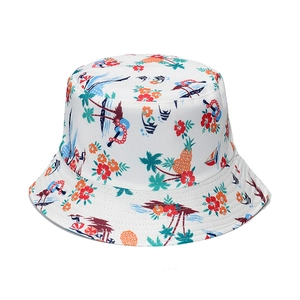 White bucket hat with tropical hibiscus flowers and palm trees pattern for sun protection