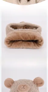 Detail of soft brown plush neck warmer with cute animal ears and knit lining