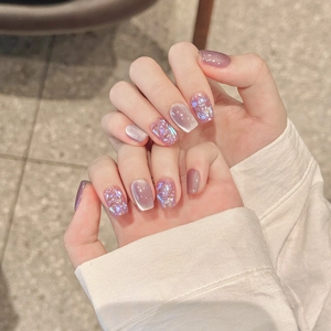 Handmade purple cat-eye press-on nails with holographic glitter and silver accents