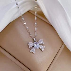 Macro view of luxurious titanium steel necklace with butterfly pendant and oval crystal