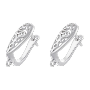 Macro shot of silver U-shaped earrings with hollow diamond knot patterns on white background