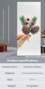 Detail view of Christmas pick featuring natural pine cones, red berries and green pine needles