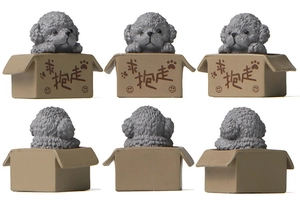 Detailed views of a miniature Poodle figurine sitting inside a small brown paper box