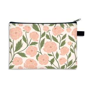 Floral print large makeup bag with zipper closure and black side handle for storage