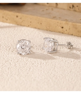 Detailed close-up of S925 sterling silver stud earrings with classic round-cut zircon stones
