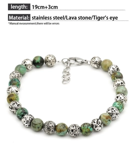 Detail of beaded bracelet with tiger's eye, lava stone, and adjustable stainless steel clasp