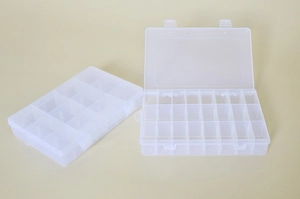 Detail of open and closed transparent plastic organizers with adjustable compartments