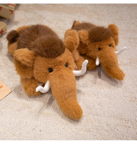 Detailed macro shot of plush mammoth toys featuring soft brown fur and white tusks