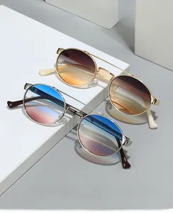 Detail view of retro double-bridge sunglasses with gradient lenses and slim metal frames