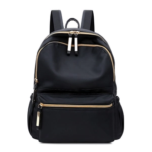 Classic black nylon backpack for women with gold zippers and multi-zipper pockets