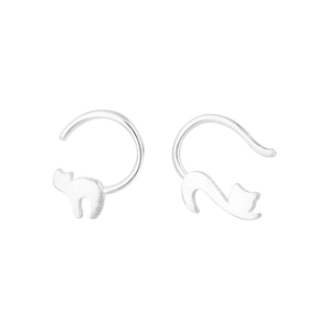Close-up of asymmetric cat earrings in polished s925 silver with cute animal design