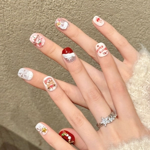 3D Christmas handmade press-on nails featuring red and white festive holiday patterns