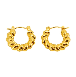 Close-up of golden titanium steel twisted hoop earrings with elegant spiral texture design