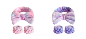 Flat lay of pink and purple gradient bow headbands with matching wristbands set