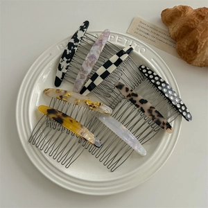 8-piece set of acetate hair side combs in cow, marble, and tortoiseshell patterns