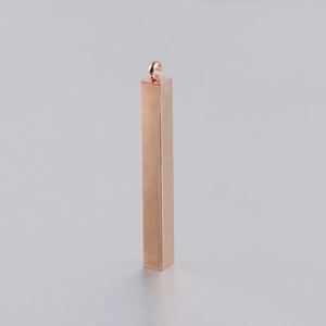 Macro view of rose gold stainless steel rectangle bar pendant with polished finish