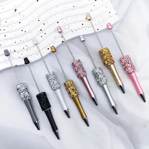 Set of multi-colored beaded ballpoint pens with shimmering crystal and resin accents