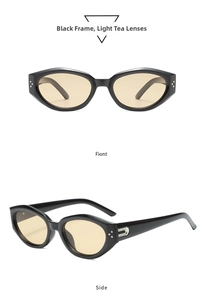 Detail view of black cat-eye sunglasses with tea lenses and silver side accents
