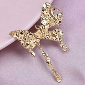 Macro shot of 304 stainless steel gold butterfly pendant with molten hammered texture