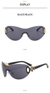 Detail view of Y2K rimless sunglasses with black lenses and gold hollow circular metal accents