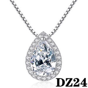 Detail of pear-cut halo pendant necklace with sparkling stone on a box chain