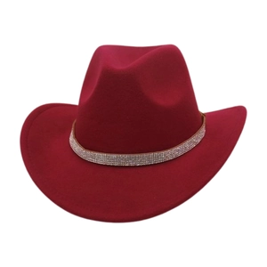 Detail of dark red felt cowboy hat featuring shimmering rhinestone band decoration