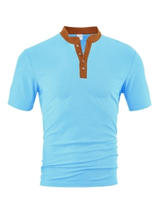 Close-up of sky blue textured knit shirt with brown trim collar and button detail