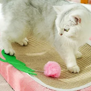 Pink corduroy sisal cat scratcher bed with hanging toy ball and green leaf decor