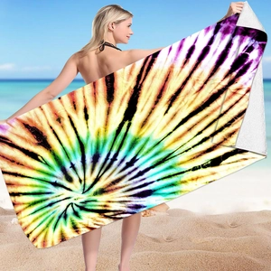 Detailed shot of microfiber tie-dye beach towel with vibrant gradient color patterns