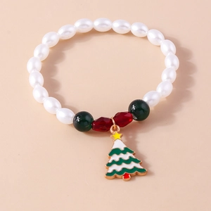 Christmas beaded bracelet with white faux pearls and a green enamel Christmas tree charm