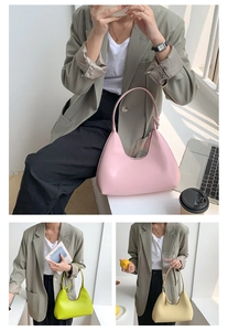 Three minimalist underarm bags in pink, lime, and beige shown in a lifestyle urban setting