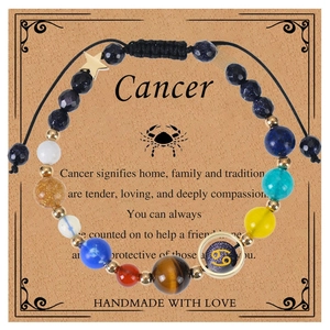 Handmade woven Cancer zodiac bracelet with natural blue sandstones and star charm on card