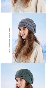 Detail of knitted winter beanie featuring textured knit patterns and a stylish logo patch
