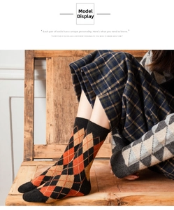 Detail of retro argyle pattern knit socks in orange and brown for autumn winter season