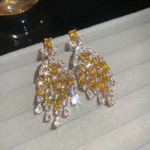 Luxurious gold zircon tassel drop earrings with sparkling pear-cut yellow gemstones