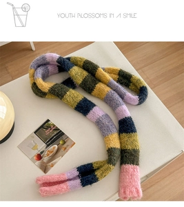 Macro view of multi-color striped knitted scarf with soft mohair texture details