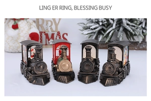 Detailed close-up of bronze vintage Christmas steam train lanterns with Santa Claus inside