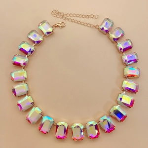 Close-up of gold choker featuring rectangular iridescent crystals and adjustable lobster clasp