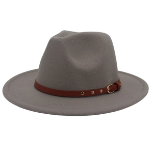 Detailed close-up of a grey wool fedora featuring a brown leather band and gold buckle