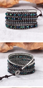 Detail view of Bohemian multi-layer leather wrap bracelet with colorful beads and metal button