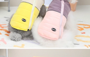 Detail of padded dog vest showing zipper closure, reflective safety strips and color blocking