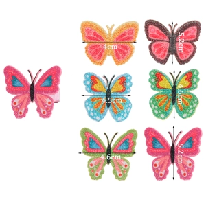 Cute butterfly hair clips in colorful glitter styles for girls and children on white back