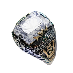 Luxury vintage men's ring featuring a large cushion-cut stone and intricate carving
