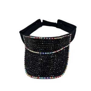 Detail of black sun visor hat with sparkling rhinestones and colorful edge crystals