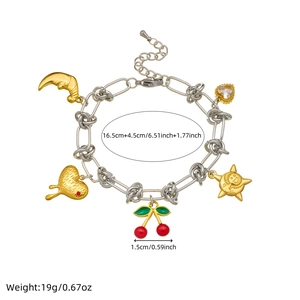 Gold plated stainless steel bracelet with cherry and bear charms on white background