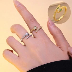 Elegant silver and gold snake rings with zircon stones shown on hand for women
