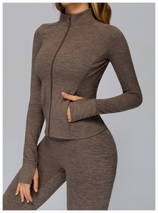 Detail of mocha gray brushed workout set featuring thumbhole cuffs and zip pockets
