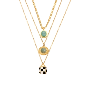 Triple-layered gold necklace with turquoise stones and checkerboard enamel pendant